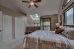Lofted master bedroom with a queen bed